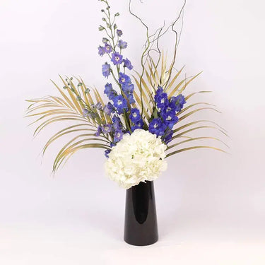 Heavenly Blooms, Flowers Artfully Arranged, Black Vase, White Hydrangea, Blue Delphinium, Golden Sprayed Areca Palm Leaves, Salix Sticks